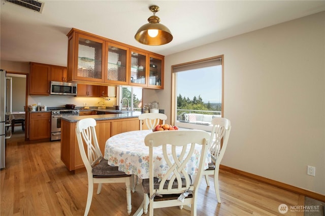 8082 Daniel Pl NW, Silverdale, WA 98383 - dining space with light wood-style floors and baseboards