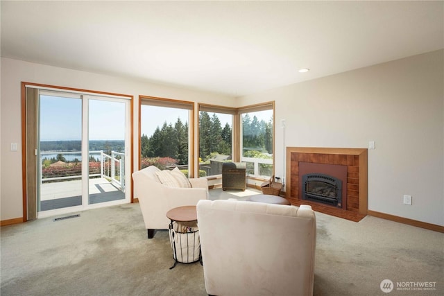 8082 Daniel Pl NW, Silverdale, WA 98383 - living room featuring carpet, a fireplace with flush hearth, baseboards, a water view, and recessed lighting