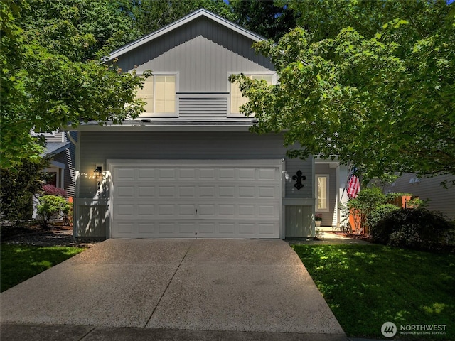 782 Fenway Ln SW, Tumwater, WA 98512 - view of property hidden behind natural elements with driveway, an attached garage, and a front lawn