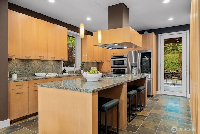530 Alexander Ave, Kirkland, WA 98033 - kitchen featuring wall chimney exhaust hood, stainless steel appliances, tasteful backsplash, stone tile flooring, and recessed lighting