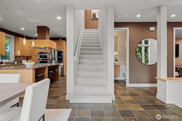 530 Alexander Ave, Kirkland, WA 98033 - staircase featuring plenty of natural light, baseboards, stone tile flooring, and recessed lighting