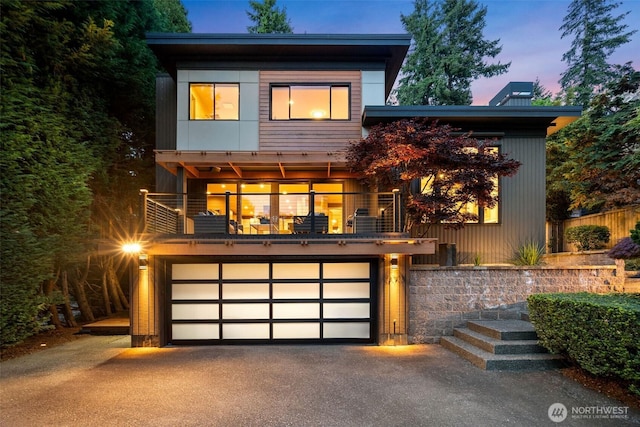 530 Alexander Ave, Kirkland, WA 98033 - contemporary house with a balcony, asphalt driveway, and a garage