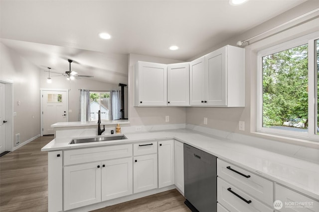 18822 Rampart Dr SE, Yelm, WA 98597 - kitchen with a sink, stainless steel dishwasher, healthy amount of natural light, a peninsula, and recessed lighting