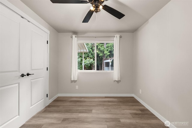 18822 Rampart Dr SE, Yelm, WA 98597 - unfurnished bedroom with baseboards, light wood-type flooring, and a ceiling fan