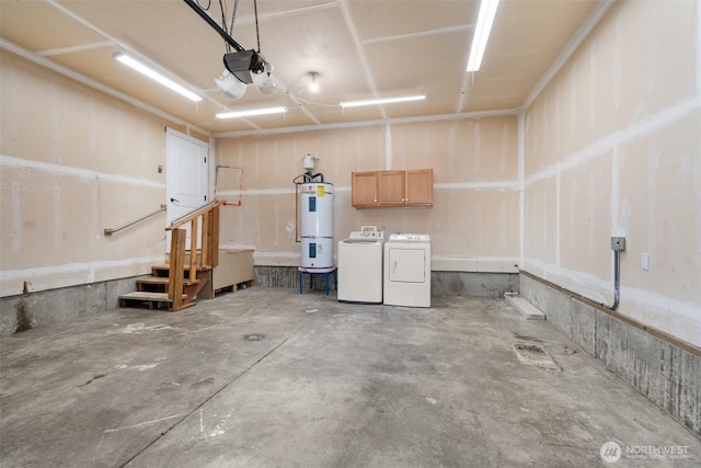 18822 Rampart Dr SE, Yelm, WA 98597 - garage featuring washing machine and clothes dryer, secured water heater, and a garage door opener