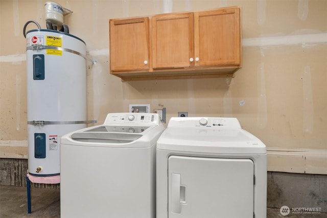 18822 Rampart Dr SE, Yelm, WA 98597 - laundry area featuring strapped water heater, cabinet space, and separate washer and dryer
