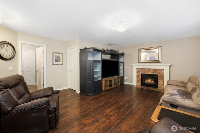 23813 109th Street Ct E, Buckley, WA 98321 - living area with dark wood-style flooring, baseboards, and a tile fireplace