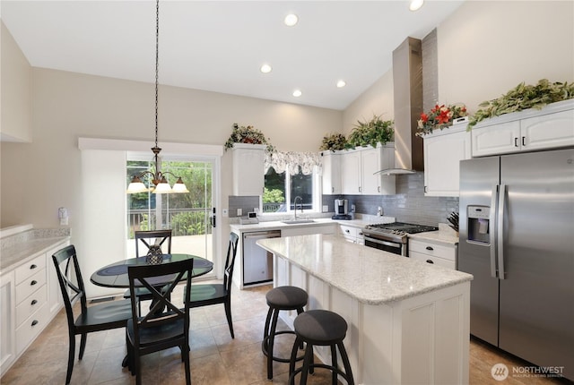 23813 109th Street Ct E, Buckley, WA 98321 - kitchen featuring stainless steel appliances, a sink, tasteful backsplash, a center island, and white cabinets