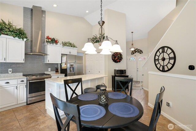 23813 109th Street Ct E, Buckley, WA 98321 - dining area with a chandelier, light tile patterned floors, high vaulted ceiling, and baseboards