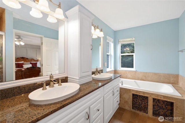 23813 109th Street Ct E, Buckley, WA 98321 - bathroom featuring connected bathroom, double vanity, a garden tub, and a ceiling fan