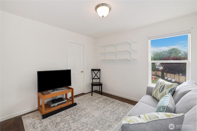 23813 109th Street Ct E, Buckley, WA 98321 - living room featuring baseboards and wood finished floors