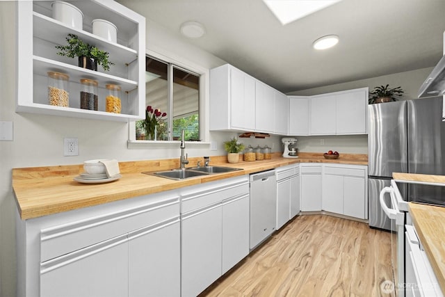 19019 Grannis Rd, Bothell, WA 98012 - kitchen with stainless steel dishwasher, butcher block countertops, a sink, electric range, and light wood-type flooring