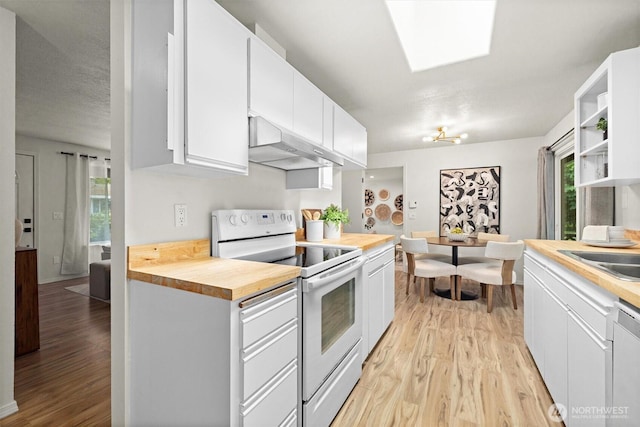19019 Grannis Rd, Bothell, WA 98012 - kitchen featuring under cabinet range hood, white range with electric stovetop, butcher block countertops, and light wood-type flooring