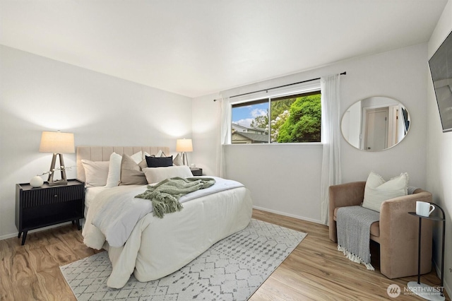 19019 Grannis Rd, Bothell, WA 98012 - bedroom featuring wood finished floors and baseboards