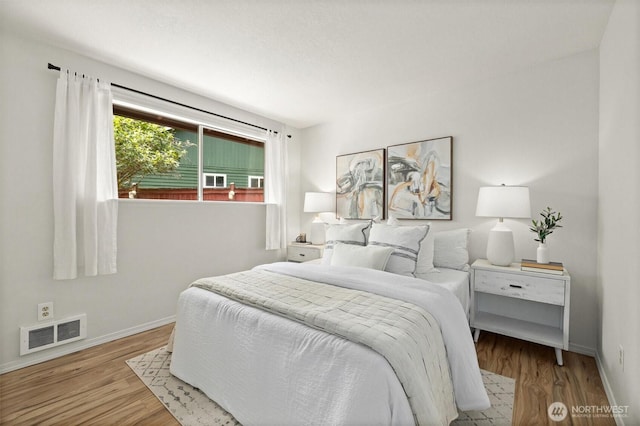19019 Grannis Rd, Bothell, WA 98012 - bedroom featuring baseboards and wood finished floors
