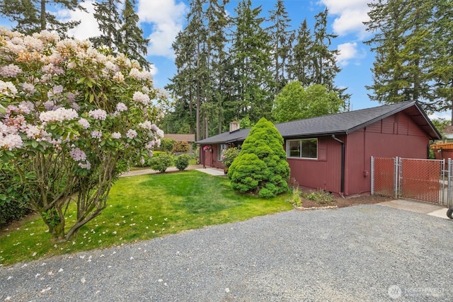 19019 Grannis Rd, Bothell, WA 98012 - view of home's exterior featuring a gate and a chimney