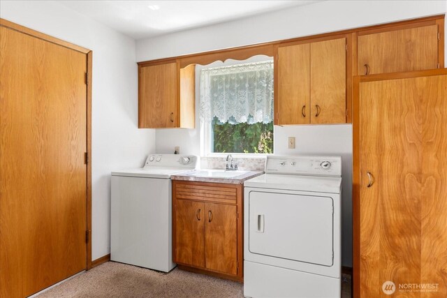 1420 Olympic Ave, Edmonds, WA 98020 - laundry area with cabinet space, light colored carpet, and washing machine and clothes dryer
