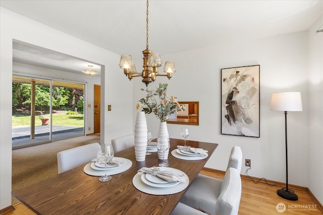 1420 Olympic Ave, Edmonds, WA 98020 - dining room featuring a chandelier, wood finished floors, and baseboards