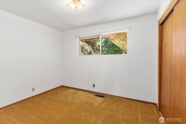 1420 Olympic Ave, Edmonds, WA 98020 - unfurnished bedroom featuring a closet, carpet floors, and baseboards