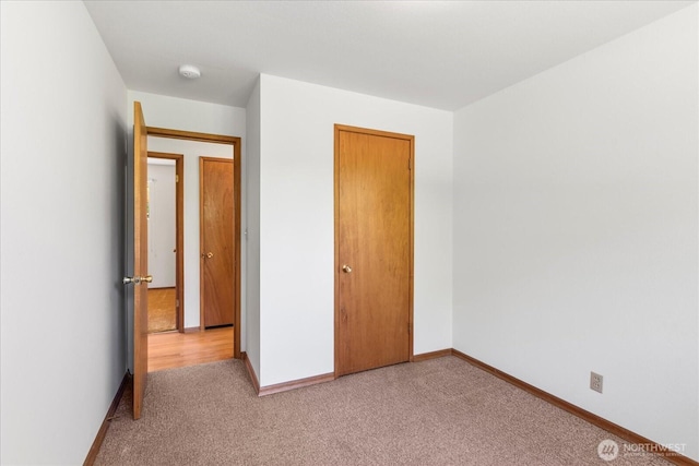 1420 Olympic Ave, Edmonds, WA 98020 - unfurnished bedroom featuring light carpet, baseboards, and a closet