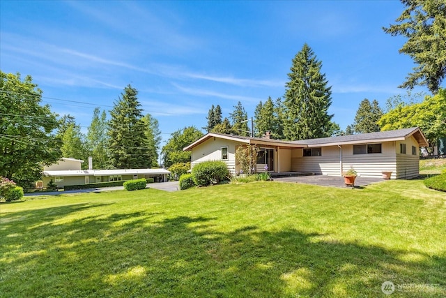 1420 Olympic Ave, Edmonds, WA 98020 - rear view of house featuring a yard and a chimney