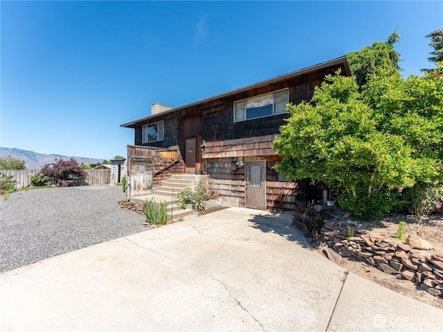 604 N Larch Ave, East Wenatchee, WA 98802 - raised ranch featuring a chimney, stairs, and driveway