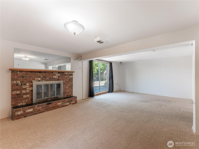 604 N Larch Ave, East Wenatchee, WA 98802 - unfurnished living room featuring carpet flooring and a fireplace