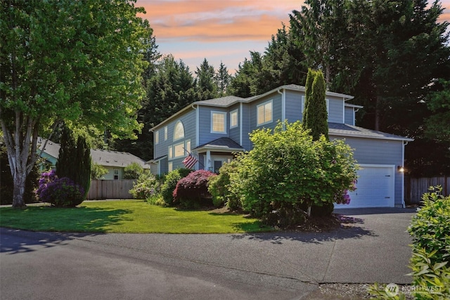 8712 177th St E, Puyallup, WA 98375 - traditional home featuring asphalt driveway and an attached garage