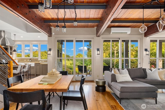 1237 Hawley Way NE, Bainbridge Island, WA 98110 - sunroom with an AC wall unit, beamed ceiling, and plenty of natural light