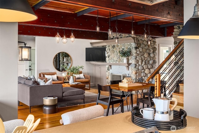 1237 Hawley Way NE, Bainbridge Island, WA 98110 - living area featuring wood finished floors, stairway, and beam ceiling
