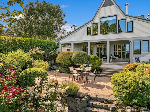 1237 Hawley Way NE, Bainbridge Island, WA 98110 - rear view of house with a patio and a porch