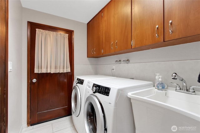 10202 Pipeline Rd E, Puyallup, WA 98373 - laundry room with washer and dryer, light tile patterned floors, and cabinet space