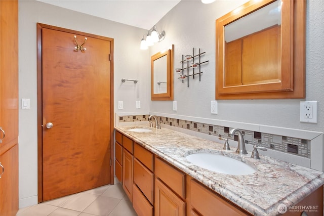 10202 Pipeline Rd E, Puyallup, WA 98373 - full bathroom with double vanity, tile patterned floors, and backsplash