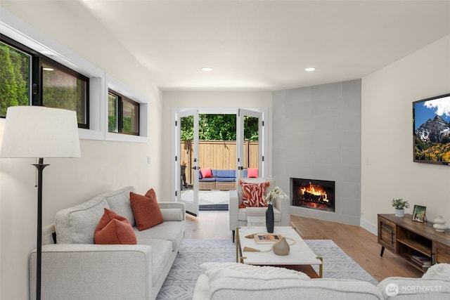 7201 Seward Park Ave S, Seattle, WA 98118 - living area featuring a fireplace, wood finished floors, recessed lighting, and baseboards
