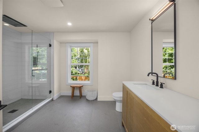 7201 Seward Park Ave S, Seattle, WA 98118 - full bathroom with healthy amount of natural light, toilet, a stall shower, vanity, and recessed lighting