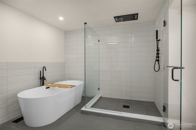 7201 Seward Park Ave S, Seattle, WA 98118 - bathroom with a stall shower, a freestanding tub, tile walls, tile patterned flooring, and recessed lighting