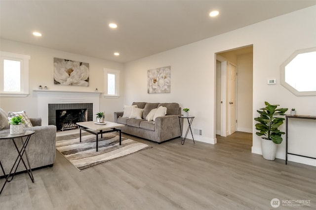 2914 S 17th St, Tacoma, WA 98405 - living area with a fireplace, light wood-style flooring, recessed lighting, and baseboards