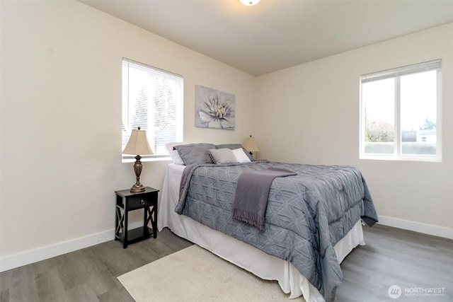 2914 S 17th St, Tacoma, WA 98405 - bedroom featuring wood finished floors, multiple windows, and baseboards