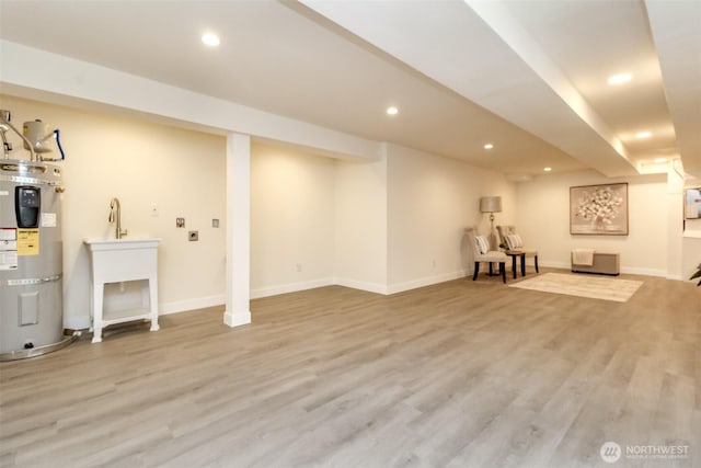 2914 S 17th St, Tacoma, WA 98405 - finished below grade area with strapped water heater, recessed lighting, wood finished floors, and baseboards