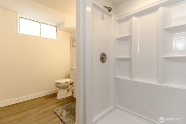 2914 S 17th St, Tacoma, WA 98405 - bathroom with a shower, toilet, baseboards, and wood finished floors