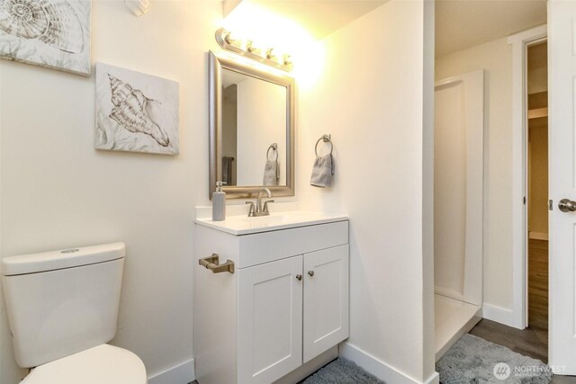 2914 S 17th St, Tacoma, WA 98405 - full bathroom featuring vanity, toilet, baseboards, and a shower