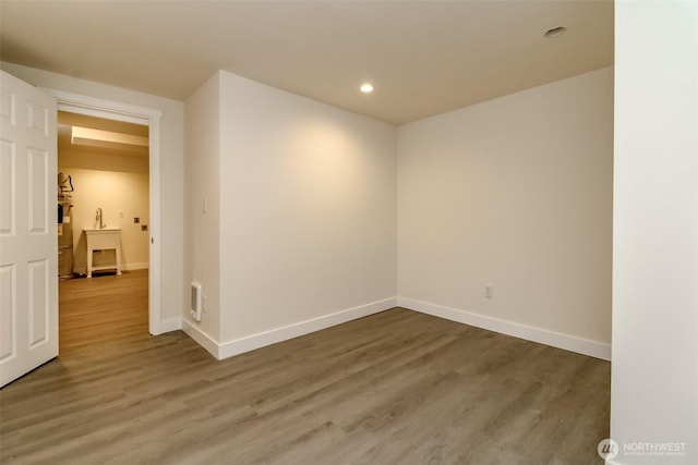 2914 S 17th St, Tacoma, WA 98405 - unfurnished room featuring baseboards, wood finished floors, and recessed lighting