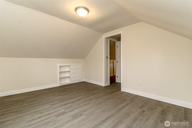 2914 S 17th St, Tacoma, WA 98405 - additional living space featuring vaulted ceiling, baseboards, wood finished floors, and built in shelves