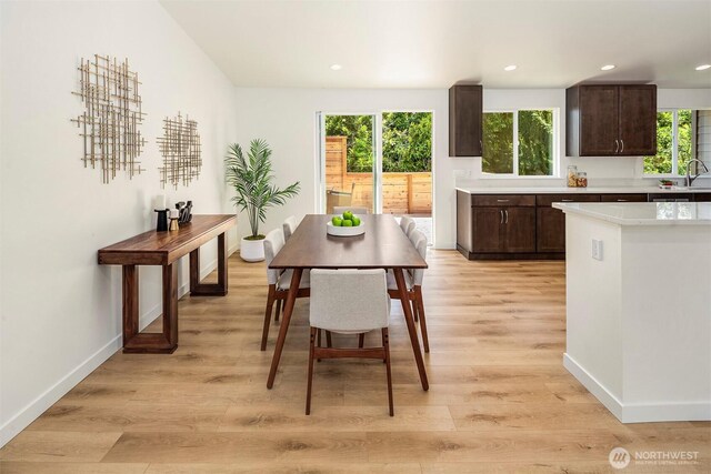 303 NE 133rd St, Seattle, WA 98125 - dining space with light wood-style floors, healthy amount of natural light, baseboards, and recessed lighting