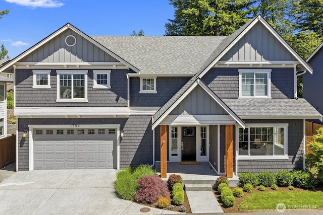 1794 Granite Way SE, North Bend, WA 98045 - view of front of home featuring board and batten siding, roof with shingles, driveway, and an attached garage