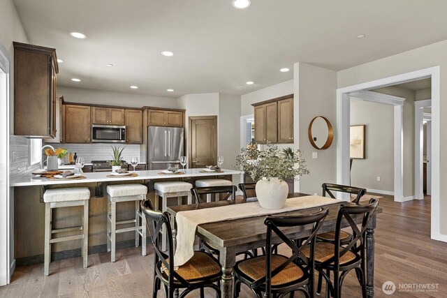 1794 Granite Way SE, North Bend, WA 98045 - dining room with recessed lighting, light wood-style floors, and baseboards