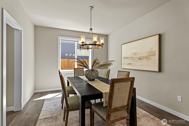 1794 Granite Way SE, North Bend, WA 98045 - dining room with a chandelier, wood finished floors, and baseboards