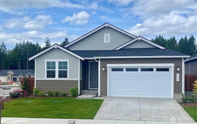 2627 Acer Loop SE, Lacey, WA 98513 - ranch-style home with concrete driveway, roof with shingles, and an attached garage