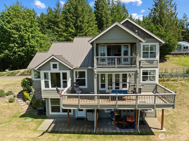 5675 E Hillcrest Dr, Port Orchard, WA 98366 - rear view of property featuring a balcony, a patio, and a yard
