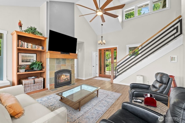 5675 E Hillcrest Dr, Port Orchard, WA 98366 - living area with ceiling fan, high vaulted ceiling, wood finished floors, a fireplace, and baseboards